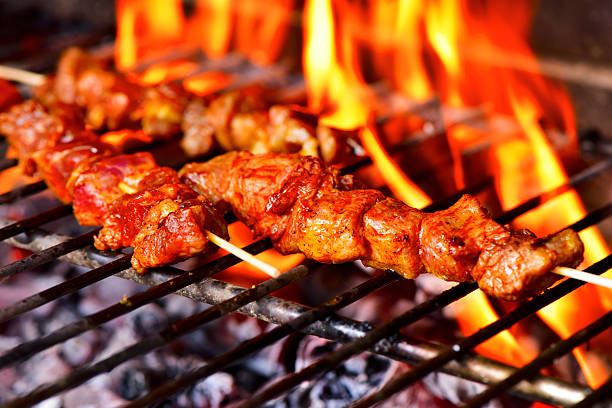 istock meat skewers in a barbecue 519084780