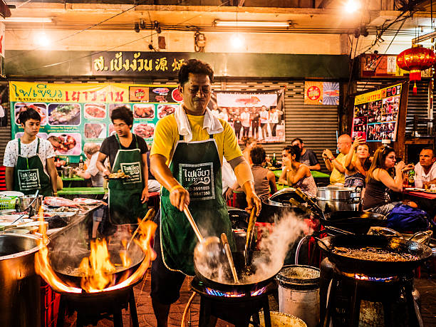 Cooking food in the street Chinatown Bangkok Thailand stock photo