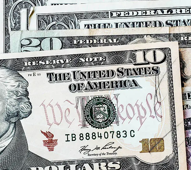 Photo of US. dollar bills background