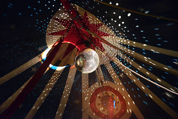 Large Disco Ball With Light Effects In Circus Tent Large DIsco Ball With Light Effects In Circus Tent. This Circus is an uncommercial Project (in Weimar) and works with children. facet joint photos stock pictures, royalty-free photos & images