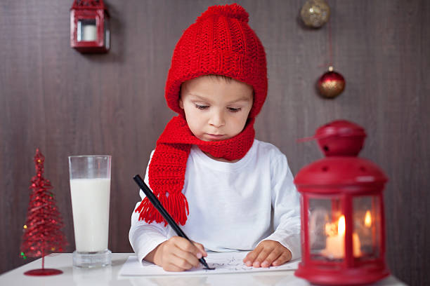 istock Adorable little boy, writing letter to Santa 519091489