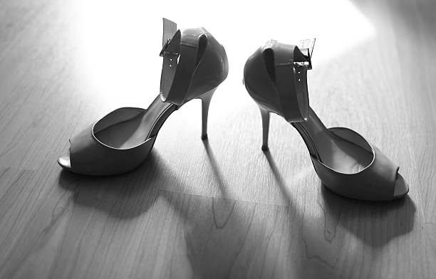 istock Bridal wedding day shoes in black and white. 519092055