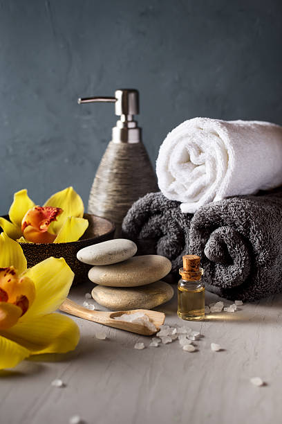 istock Orchid flower, towel, aroma oils, zen stones 519092344
