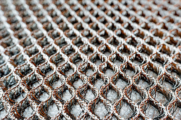 istock Slightly defocused and closeup of steel mesh and wire texture 519092351