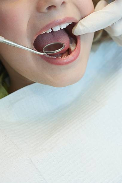 istock Child having a dental examination 519092656