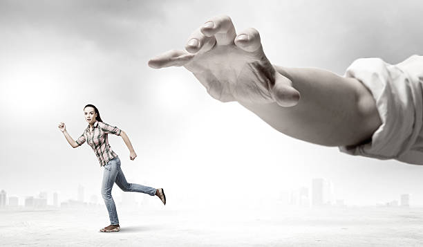istock Woman escape from hand 519093875