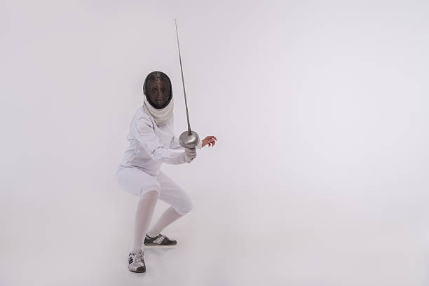 istock Young woman engaging in fencing 519093941