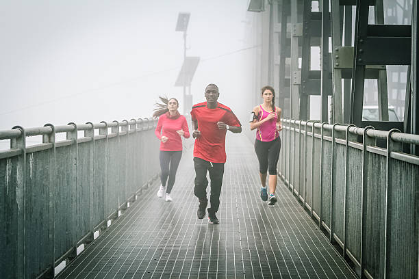 istock Friends Running in the fog on Iron Bridge 519094965