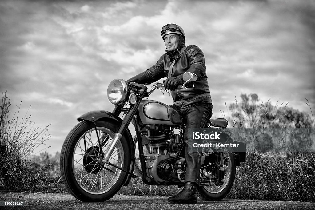biker on vintage motorcycle biker on vintage motorcycle ready for a ride Motorcycle Stock Photo
