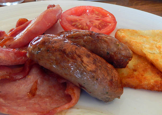 istock Full English fried breakfast, sausages, bacon, fried egg, hash browns 519096311