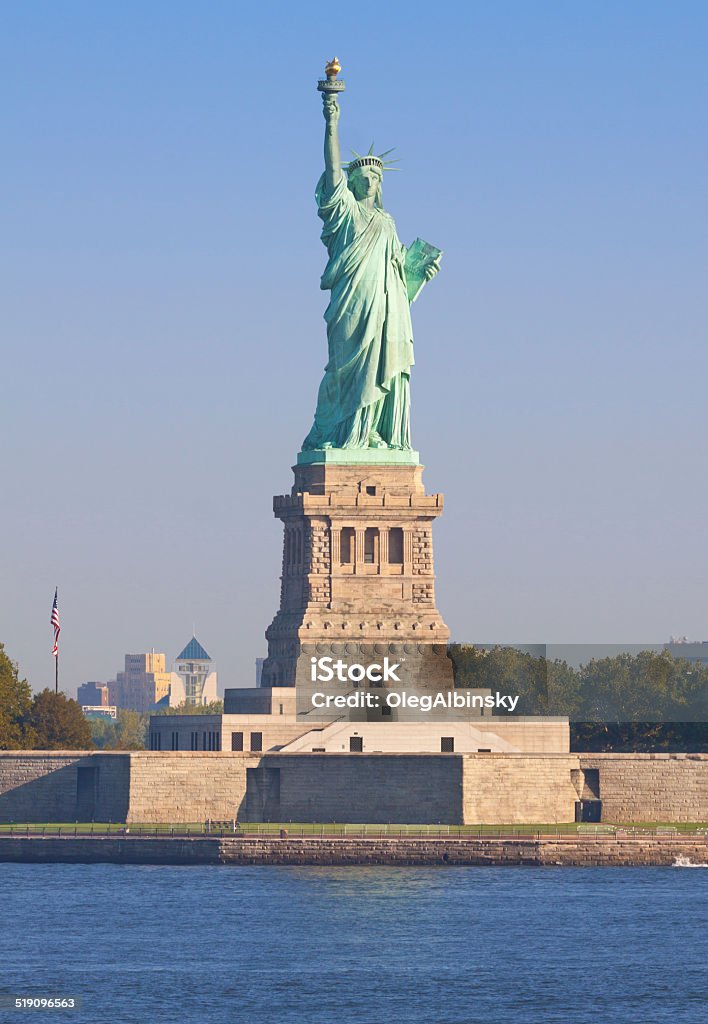 Statue of Liberty in the morning, New York City. Statue of Liberty, lit by the morning sun, New York City. Canon EF 70-200mm f/4L IS lens. American Culture Stock Photo