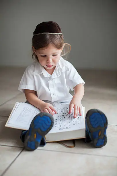 Boy learning Aleph Bet (hebrew alphabet)