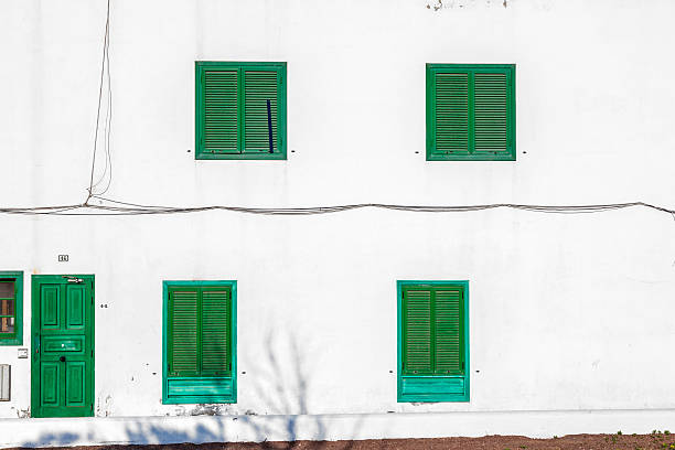 istock facade of mediterranean house with closed shutterblinds 519107631