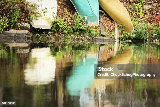 Canoe Kayak Sailboat Dinghy Shore Reflection Stock Photo - Download Image Now - Camping, Canoe, Canoeing