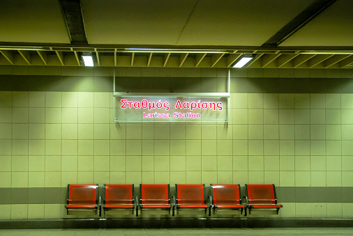 Seating and Sign at the Larissa Metro station in Athens.