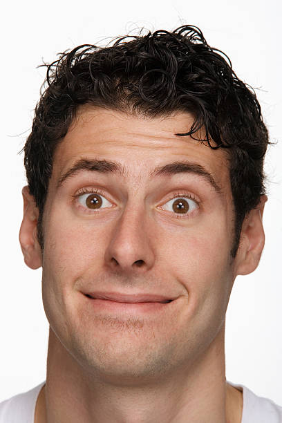 istock Young man making face, portrait, close-up 519110665