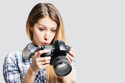 Woman photographer with DSLR camera