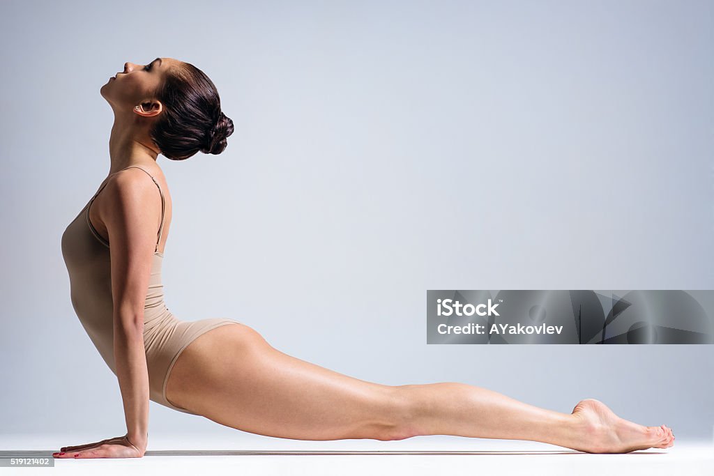 yoga woman young beautiful yoga female posing on a studio background Active Lifestyle Stock Photo