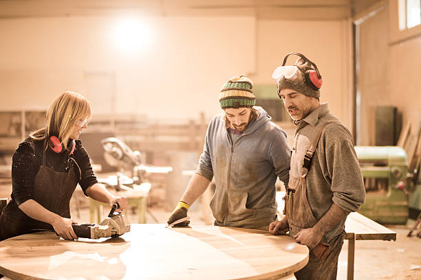 istock Team of craftspeople in workshop 519122734