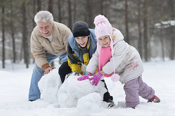 istock happy  family playing in fresh snow 519124706