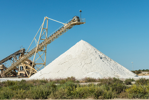 Sea salt is salt produced from the evaporation of seawater. Industrial salt production happens in salt pans. With diggers and band-conveyors the salt will be formed to white hills.
