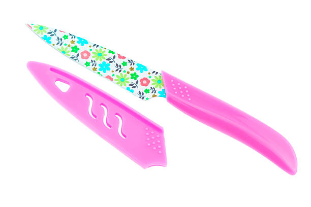 istock pink knife and cover isolated on white background. 519126454