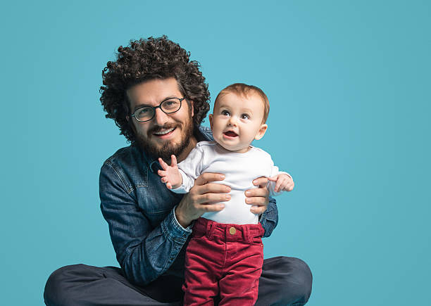 istock Father and daughter on blue background, Smiling portrait 519126718