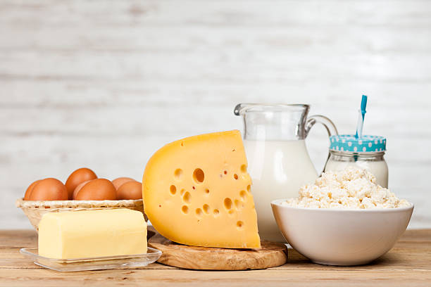 istock Milk jar on wooden table 519128216