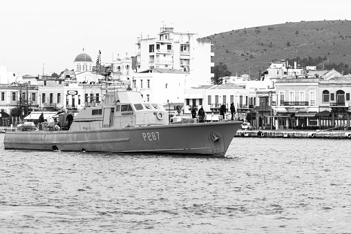 Chios, Greece - March 18, 2016: The Antoniou class patrol boat of Greek Navy, P-287 HS Kelefstis Stamou in the harbor of Chios Town on the Greek island, Chios. The vessel is used for patrolling the Aegean Sea between the Turkish coastline and the Greek Islands where refugees arrive after a dangerous travel by small inflatable boats.