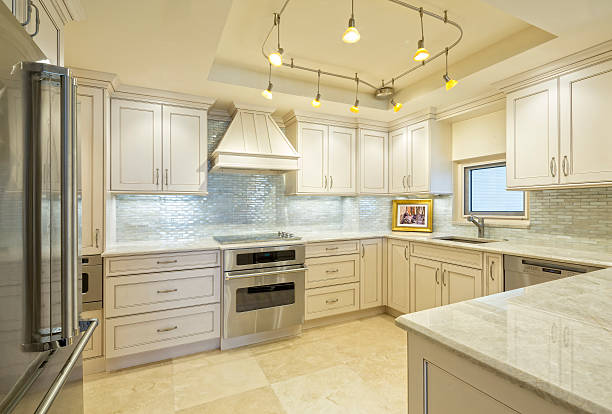 Beautiful Remodeled Kitchen in a Condominium Beautiful Remodeled Kitchen in a Condominium. (Picture in frame is mine.) cabinet stock pictures, royalty-free photos & images