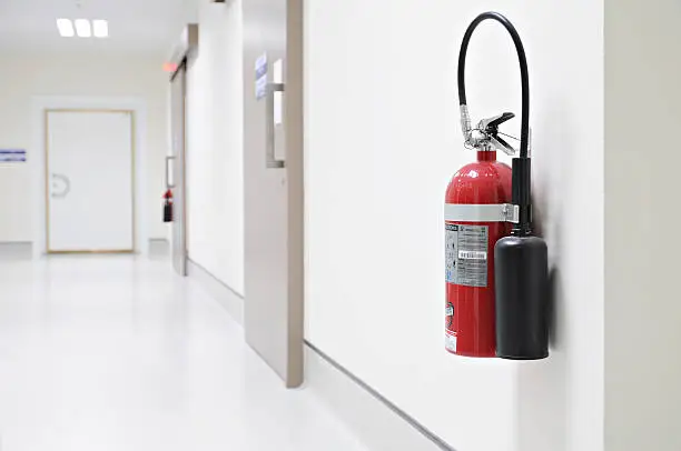 Photo of Install a fire extinguisher on the wall in hospital