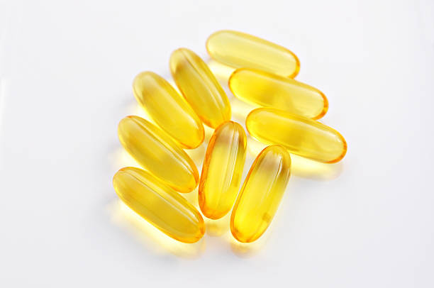istock Cod liver oil omega 3 gel capsules isolated ,White background 519129917