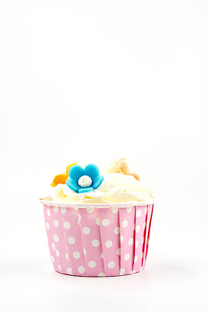 istock cupcake with butter cream icing isolated on white. 519130173