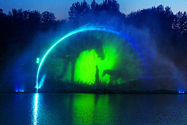 Biggest fountain on the river in Vinnytsia, Ukraine Vinnytsia, Ukraine - May 31, 2015:Biggest fountain on the river in Vinnytsia, Ukraine. Located in the river Southern Buh fountain has a length of 140 meters and the height of the jet up to 60 m, it is equipped with a laser system that allows to display animations directly to the fountain jets vinnytsia stock pictures, royalty-free photos & images