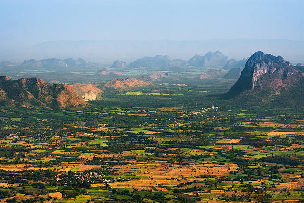 istock View small village in valley on smog day. 519131664