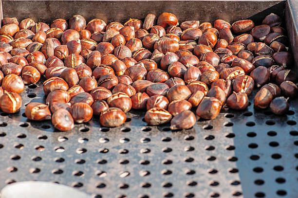 Grilling Chestnuts stock photo
