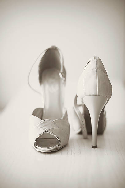 istock Bridal shoes on the white table. 519133386