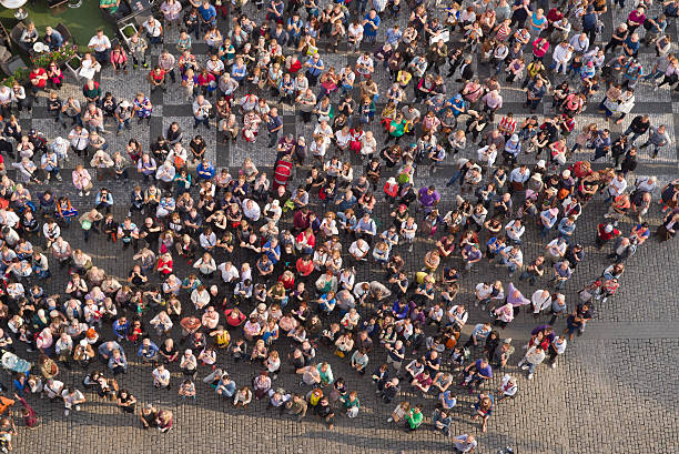 touristen in prague old town square - tourist day prague crowd stock-fotos und bilder