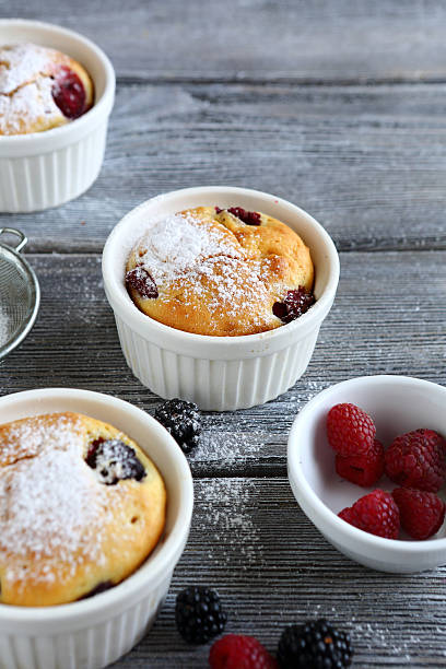 istock berry muffins on wooden background 519133611