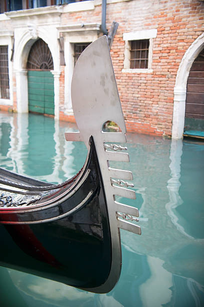 istock Gondola moored in a venetian canal 519133983