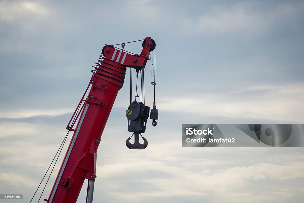 Crane hook Building crane boom with steel hook Architecture Stock Photo