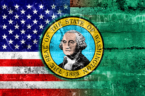 USA and Washington State Flag painted on grunge wall