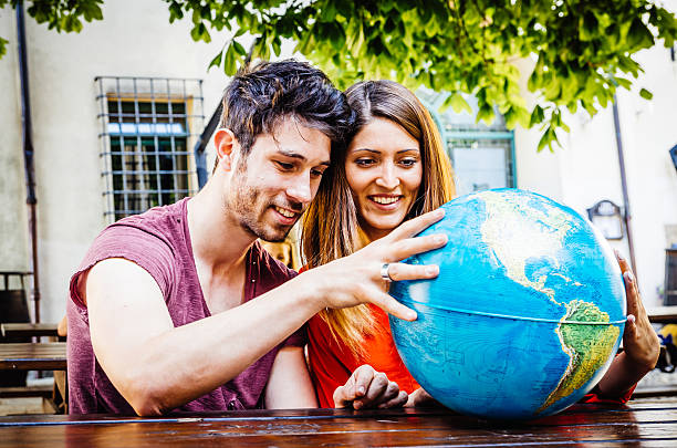istock Young Couple Thinking About Where To Go On Trip 519135061