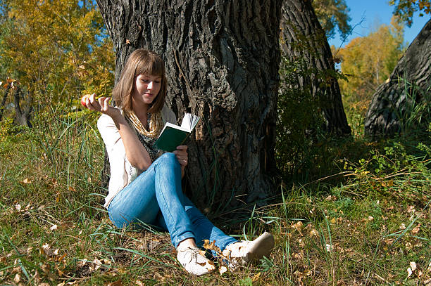 istock The beautiful girl at a tree 519135377