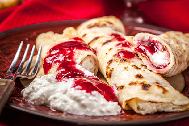 istock Rolled crepes stuffed with cottage cheese. 519156860