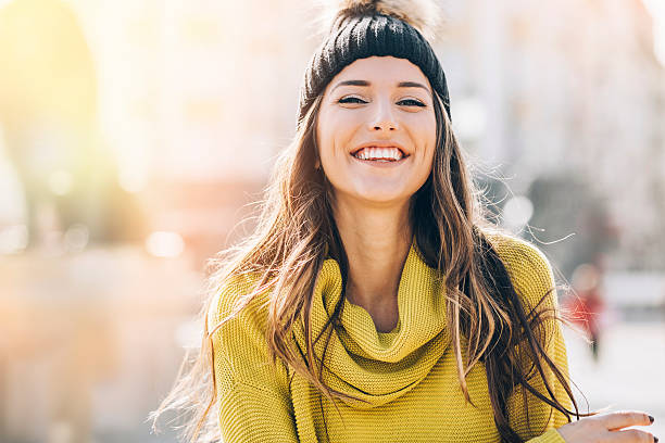 istock Smiling young woman at sunlight 519157650