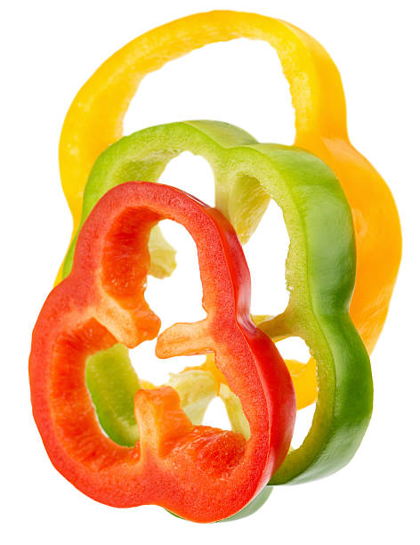 istock red, green and yellow pepper slices isolated 519157944