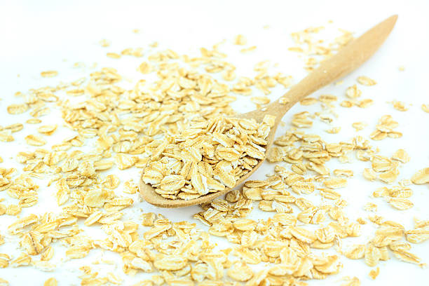 istock Rolled oats in a wooden spoon on a rolled oats 519161716