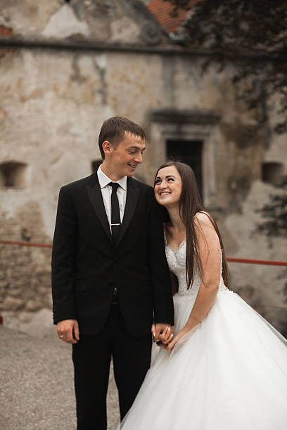 istock Happy wedding couple hugging and smiling each other on the 519162796