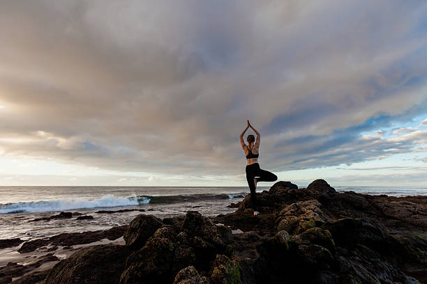 istock Sunrise yoga session on beach 519162916